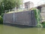 Remains of demolished bridge 35, Regents Canal, London, England.